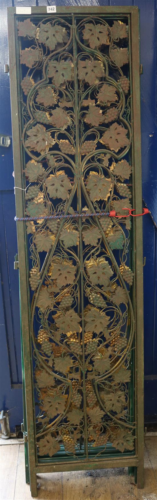 A metal panelled screen, each panel W.45cm